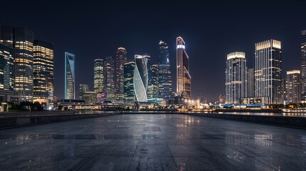 Fototapeta premium Sleek urban skyline at night with geometric buildings, soft window lights, empty foreground and refined atmosphere for premium branding, finance and technology campaigns