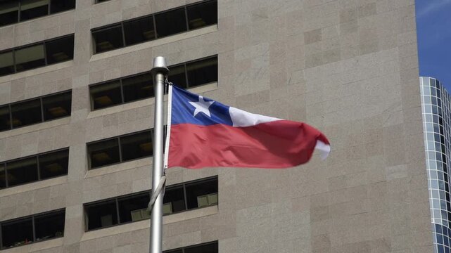 The Chilean flag on a flag pole at Toronto City Hall&rsquo;s Nathan Phillips Square.