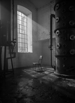 The lonely chair in an abandoned factory, art background with copy space