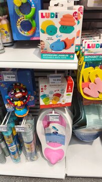 Royan, France - July 25, 2026: E.Leclerc ROYAN CEDEX. Colorful children's bath toys displayed on a store shelf, including LUDI brand washables and various colorful accessories for kids