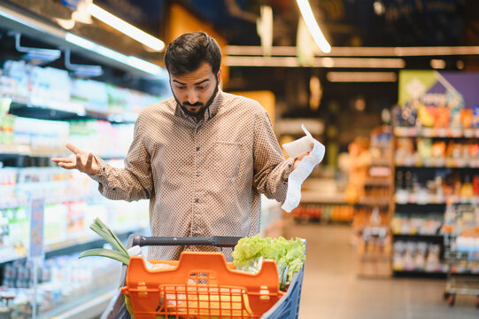 Man feeling confused by high grocery store prices