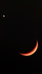 Crescent moon conjunction with Venus planet in dark night sky, astronomical phenomenon © Reno