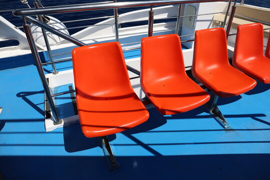 Plastic chairs on a cruise ship.