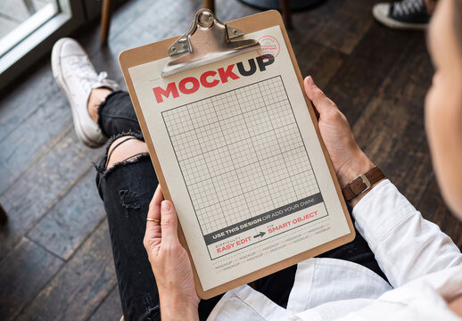 Person Holding Clipboard Page Mockup