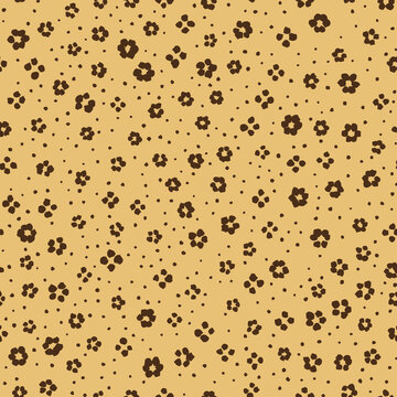 Seamless leopard print pattern in brown on gold