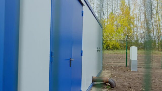 High-voltage electrical substation operates within industrial environment. Modern equipment ensures dependable electricity distribution