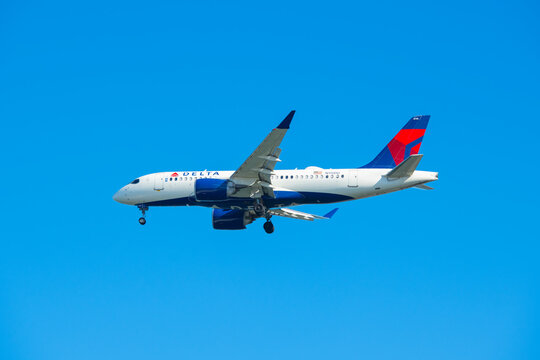 Delta Air Lines Airbus 220-100 N115DU landing on Boston Logan International Airport (BOS), Boston, Massachusetts MA, USA. 