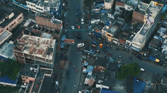 4k Top Down Aerial View of Busy City Traffic Intersection and Flyover Bridge in India.