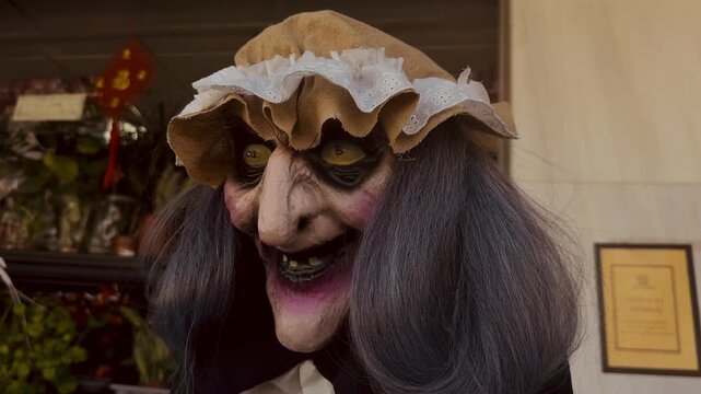 Halloween witch decoration video, scary prop outside shop