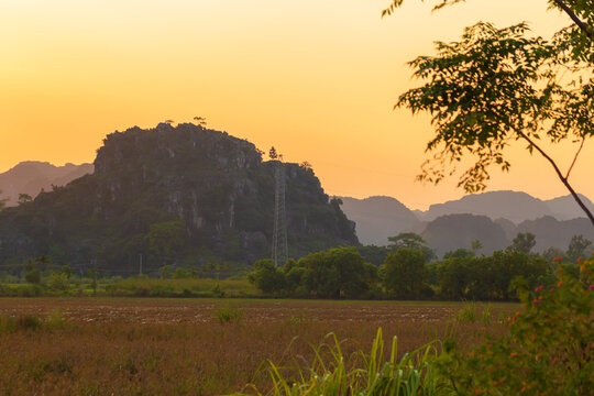 Picturesque karst landscape near Tam Coc village at sunset. Ninh Binh, Vietnam.