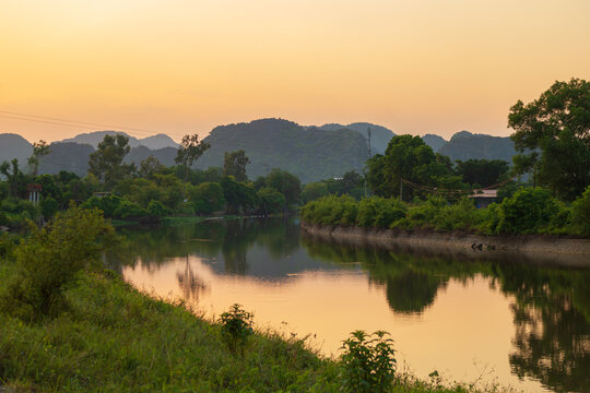 Picturesque karst landscape near Tam Coc village at sunset. Ninh Binh, Vietnam.