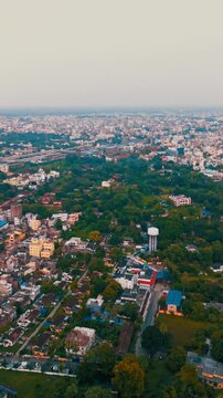 Modern Architecture in India: 4K Aerial View of the Building and City Skyline at Haze. Top down Buildings and Apartment with Multiple Building aerial.	