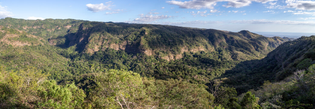 Panoramic view across the Guayapa River valley from Mirador El Mulo lookout in El Imposible National Park, Ahuachap&aacute;n, Western El Salvador.