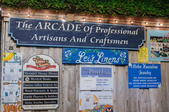 St. Augustine,FL,USA - Dec.30.2024: A large wooden sign identifies the Arcade of Professional Artisans and Craftsmen in St. Augustine, Florida. Smaller signs advertise local jewelry, photography