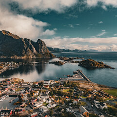 High angle panoramic view of Reine fishing village with bridges and Olstind mountain in fjord in Lofoten Norway © Quality by Simon