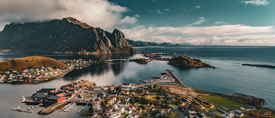 High angle panoramic view of Reine fishing village with bridges and Olstind mountain in fjord in Lofoten Norway © Quality by Simon