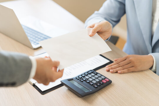 Good job, asian manager business giving financial reward in an envelope, business letter extra salary to company employee, woman worker office hand received premium bonus, getting cheque from her boss