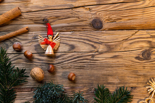 Traditional Czech Christmas on wood decoration with twig, apple, orange, fruit