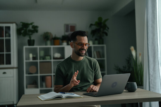 Man smiling having video call during remote work