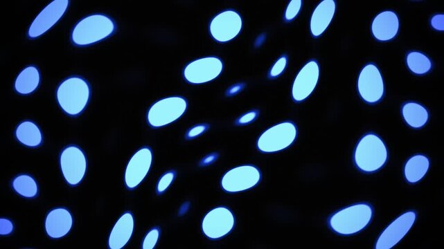 Abstract neon blue polka dot pattern waving in motion background loop
