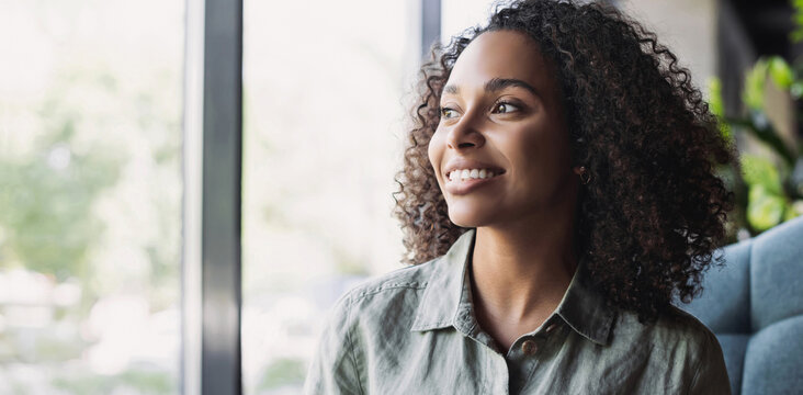 Young beautiful african american woman smiling indoor  panoramic banner, pretty student girl closeup portrait