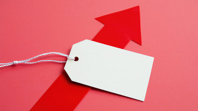 Blank white price tag attached to a red upward arrow on a pink background, representing rising prices, sales growth, and retail marketing.