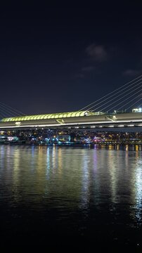 night illumination istanbul city famous traffic bridge riverside bay vertical panorama 4k timelapse turkey 