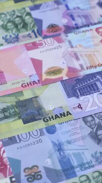 Ghana, Ghanaian paper money, cedi banknotes and pesewa coins as currency for exchange or travel. Ghana money as a business background