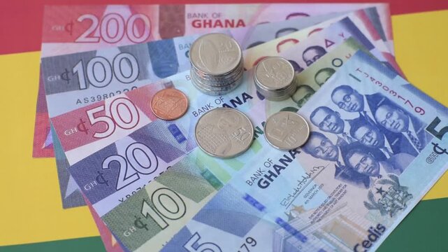 Ghana, Ghanaian paper money, cedi banknotes and pesewa coins as currency for exchange or travel. Ghana money as a business background