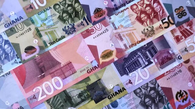 Ghana, Ghanaian paper money, cedi banknotes and pesewa coins as currency for exchange or travel. Ghana money as a business background