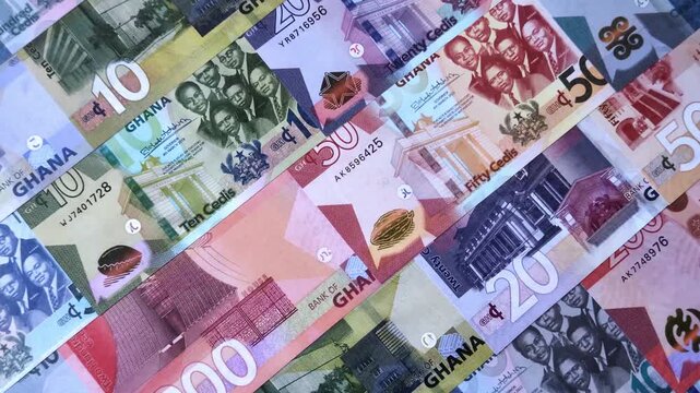 Ghana, Ghanaian paper money, cedi banknotes and pesewa coins as currency for exchange or travel. Ghana money as a business background
