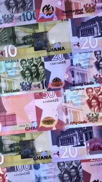 Ghana, Ghanaian paper money, cedi banknotes and pesewa coins as currency for exchange or travel. Ghana money as a business background