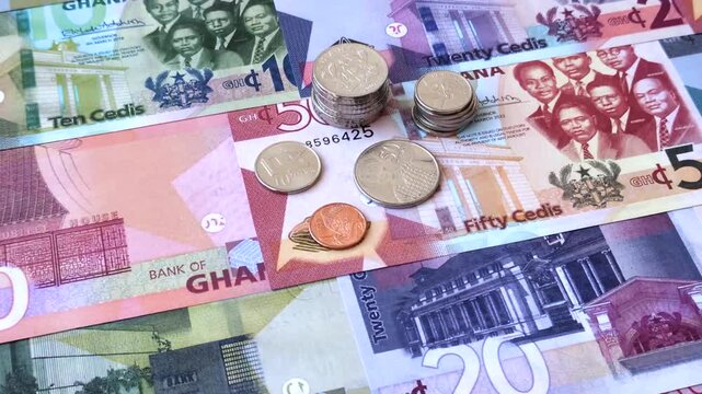 Ghana, Ghanaian paper money, cedi banknotes and pesewa coins as currency for exchange or travel. Ghana money as a business background