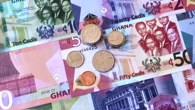 Ghana, Ghanaian paper money, cedi banknotes and pesewa coins as currency for exchange or travel. Ghana money as a business background