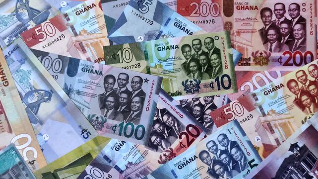 Ghana, Ghanaian paper money, cedi banknotes and pesewa coins as currency for exchange or travel. Ghana money as a business background
