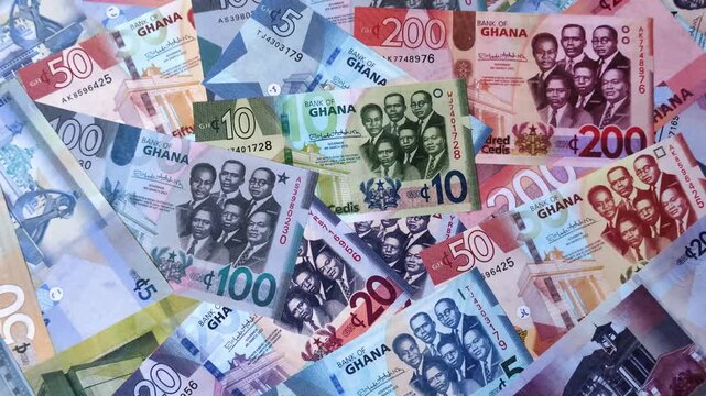 Ghana, Ghanaian paper money, cedi banknotes and pesewa coins as currency for exchange or travel. Ghana money as a business background