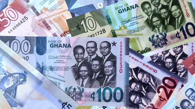 Ghana, Ghanaian paper money, cedi banknotes and pesewa coins as currency for exchange or travel. Ghana money as a business background