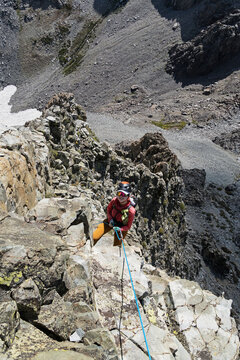 Woman Rappelling Off Devils Crag Number 9 In The Sierra Nevada Mountains
