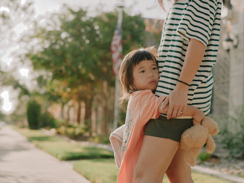 girl hugging an adult