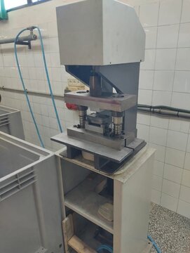 Industrial eccentric press punching aluminium profile in factory