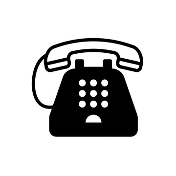 Vintage rotary telephone with dial pad and coiled cord on clean background
