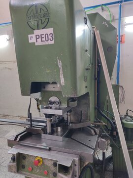 CNC aluminium profile machining center with metal chips in factory workship