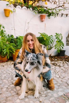 Woman Embracing Her Dog