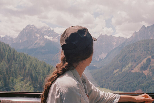 Anonymous woman looking at the mountains from the cable car