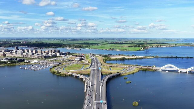 Aerial view of highway A10, Zeeburgereiland and Enneus Heerma Bridge in Amsterdam