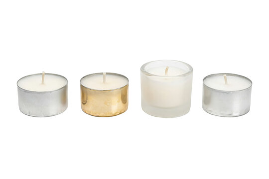 Four small unlit tea light candles in metal and glass holders arranged in a row isolated on a transparent background