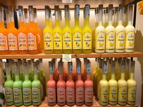 Liquor store. Limoncello in assortment, sweet fruit liqueurs. Palermo, Italy, September 2, 2026.