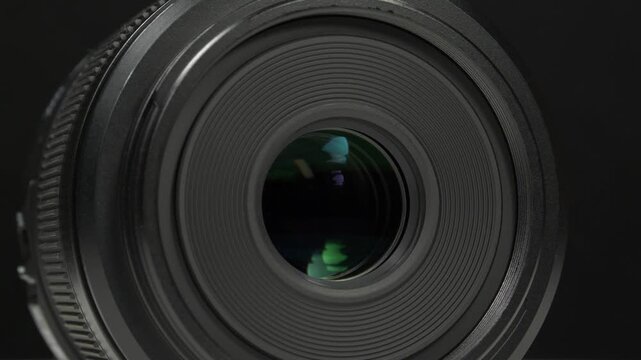 Professional black macro camera lens designed for capturing intricate details, sharp close-up images, and stunning textures with precision and clarity
