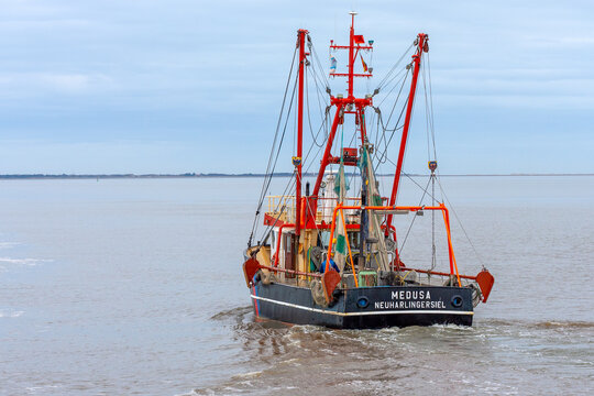 fishing cutter Medusa, a shrimps trawler leaving the harbor to go on a fishing catch.