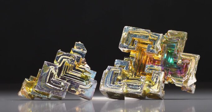 Colorful bismuth crystals with stepped structures and vibrant iridescent surfaces showcasing the distinctive beauty of this fascinating metallic element